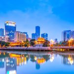Chengdu city lights reflected in the river at dusk