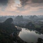 Aerial view of the river bend through Guilin, ringed by limestone peaks