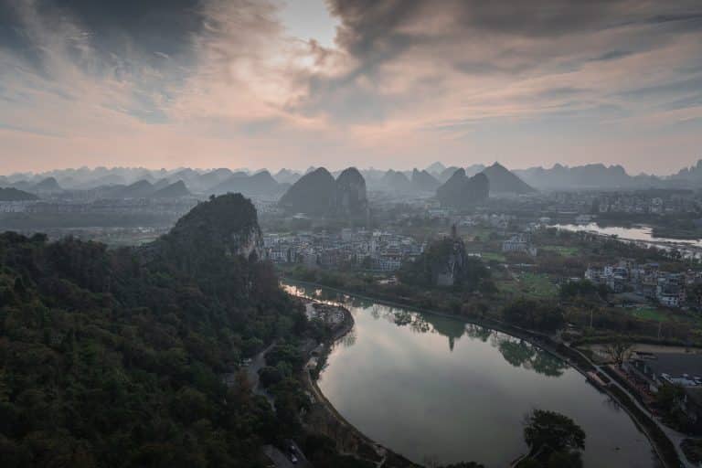 Aerial view of the river bend through Guilin, ringed by limestone peaks