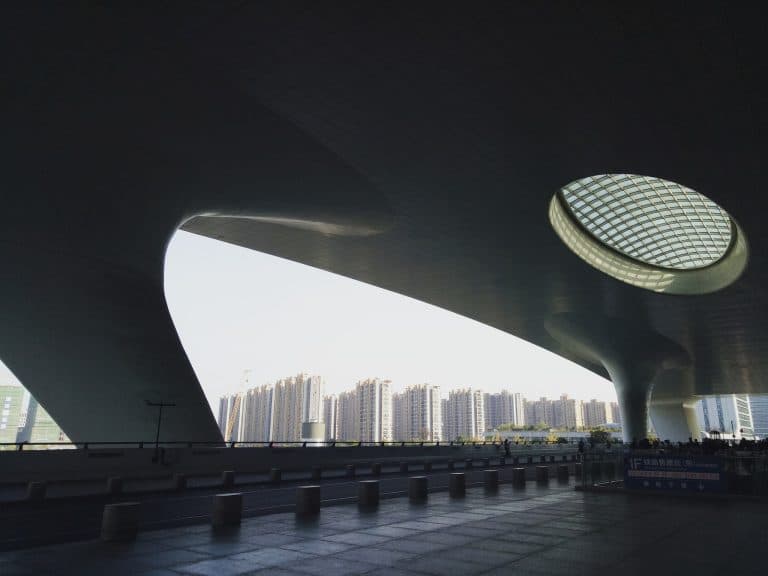 Curved white canopy roof with an oval skylight at the entrance of Hangzhou East Railway Station, the departure station for high-speed trains to Shanghai.