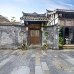 Stone and timber courtyard gateway on Kuan Alley in the Kuanzhai Alley quarter of Chengdu, Sichuan
