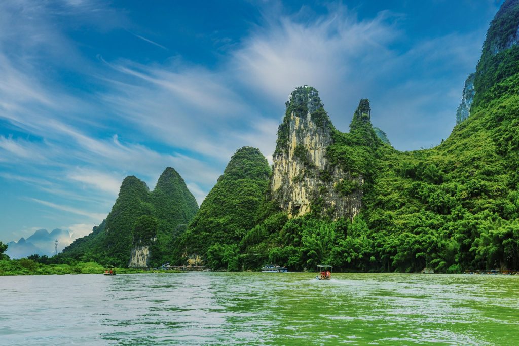 Green karst peaks above the Li River under a clear sky