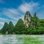 Green karst peaks above the Li River under a clear sky