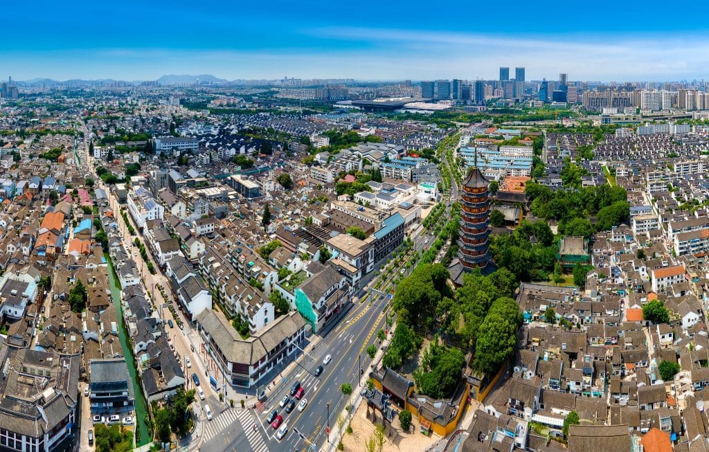 Aerial view of North Temple Pagoda rising above the old town rooftops of Suzhou