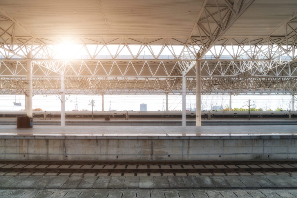 A high-speed train leaving a station platform in Shanghai