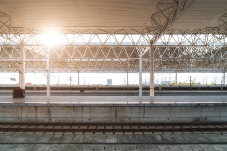 A high-speed train leaving a station platform in Shanghai