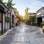 Restored shopfronts and planters along a lane in the Kuanzhai Alley quarter of Chengdu