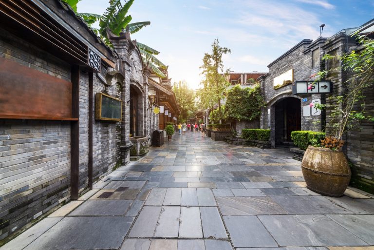 Restored shopfronts and planters along a lane in the Kuanzhai Alley quarter of Chengdu
