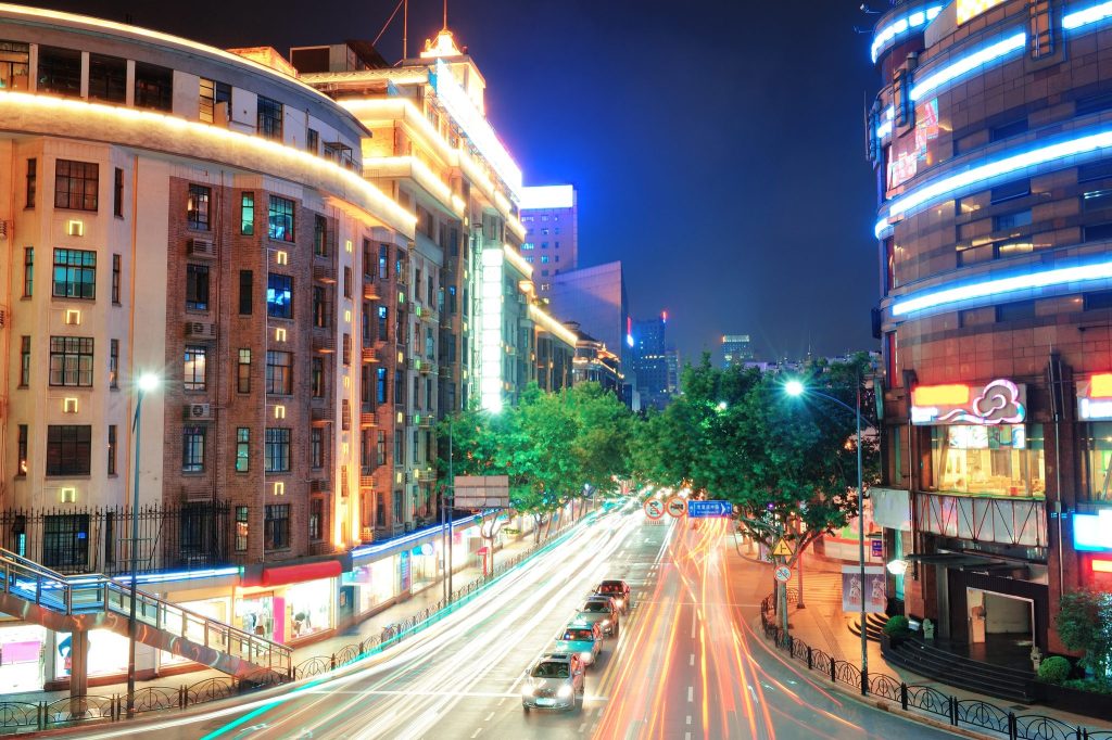 Traffic and neon on a Shanghai street at night