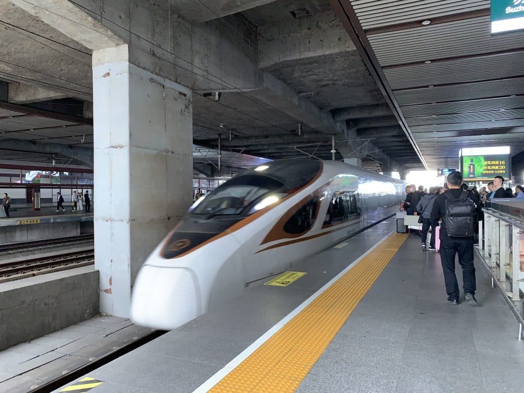 High-speed train arriving at a platform at Suzhou Railway Station, Jiangsu, China