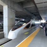 High-speed train arriving at a platform at Suzhou Railway Station, Jiangsu, China