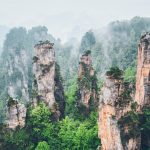 Forested sandstone pillars of the Zhangjiajie mountains in mist