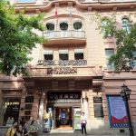 Facade of the Modern Hotel (Madieer) on Central Street, Harbin, with its MODERN sign and ground-floor cafe