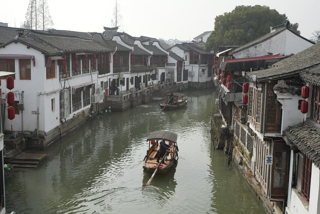 Canal lined with old houses and a wooden boat in Zhujiajiao water town, Qingpu, Shanghai