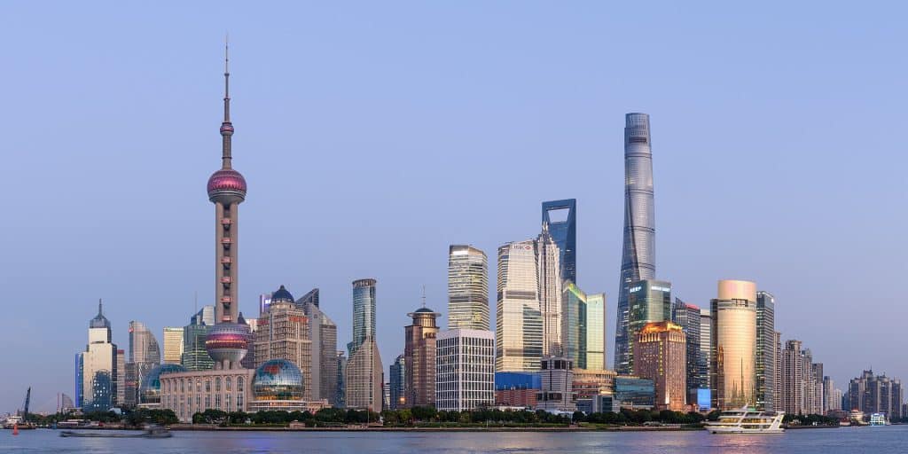Panorama of the Pudong skyline with the Oriental Pearl Tower and Shanghai Tower across the Huangpu River