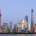 Panorama of the Pudong skyline with the Oriental Pearl Tower and Shanghai Tower across the Huangpu River